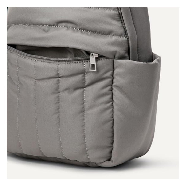 Person wearing a black ergonomic backpack, ideal for comfortable daily use, travel, and casual outings.