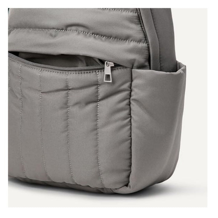 Person wearing a black ergonomic backpack, ideal for comfortable daily use, travel, and casual outings.