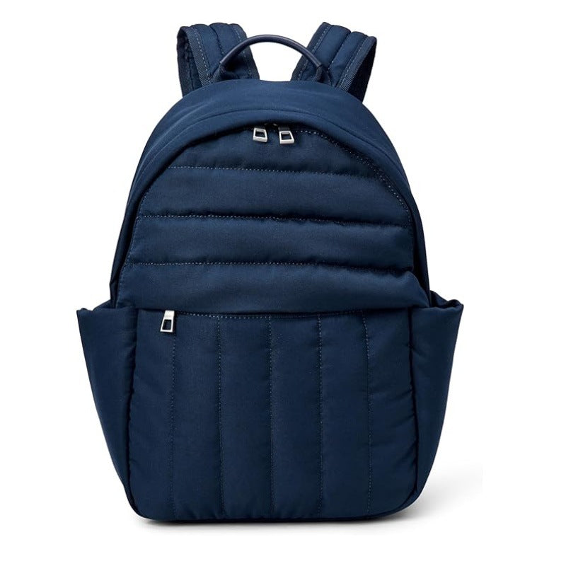 Close-up of durable, high-quality fabric and robust zippers on a versatile ergonomic travel backpack.