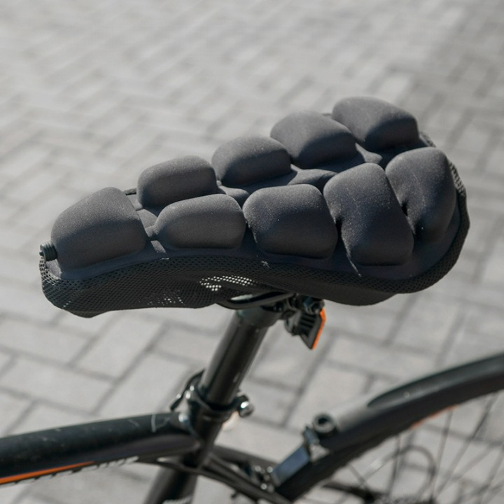 Unisex ergonomic bike seat cushion for enhanced cycling comfort & pressure relief.