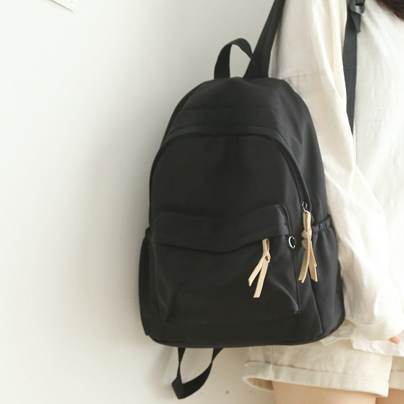 Vibrant red unisex travel backpack with a spacious main compartment. Ideal for daily commute, work, or school.