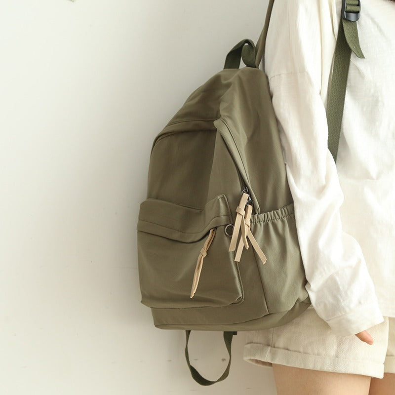 Spacious interior of a unisex everyday backpack showing organized compartments for laptop, books & essentials.