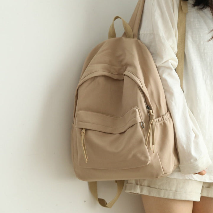 Close-up of comfortable, padded shoulder straps on a durable unisex backpack, ideal for long wear & travel.