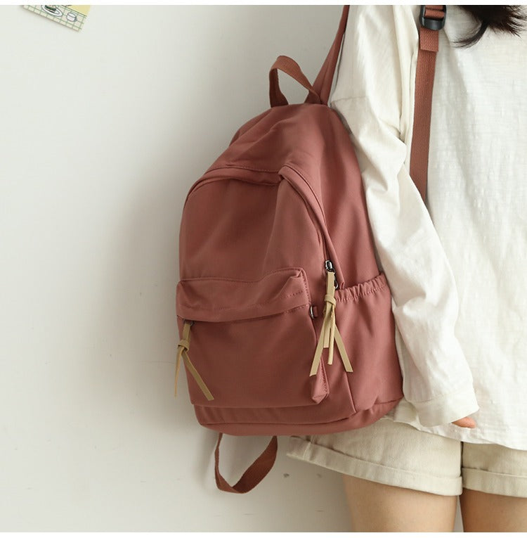 Textured view of the durable, high-quality fabric of a unisex everyday backpack, built for work, travel & school.