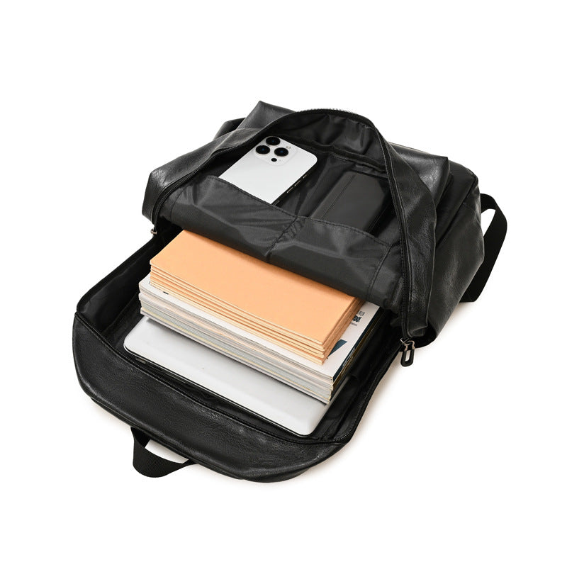 Unisex leather laptop backpack with organized storage for work essentials. Ideal for daily commute.
