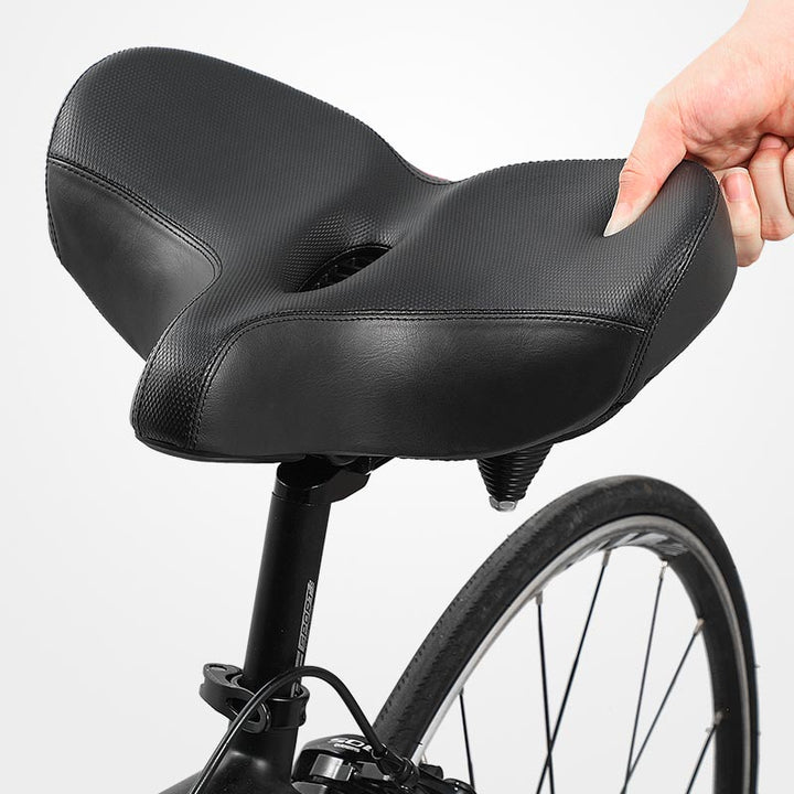 Ergonomic unisex bicycle saddle, extra wide with memory foam & shock absorption for comfortable rides.