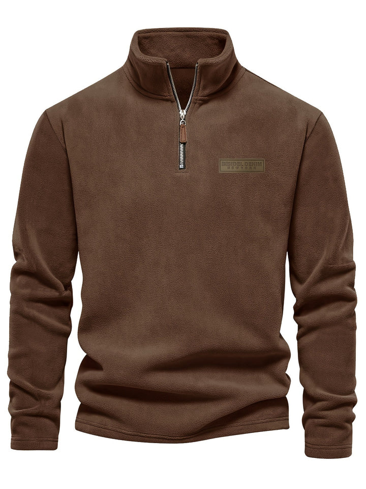 Warm unisex half-zip pullover with high collar and soft fleece lining for cold days.