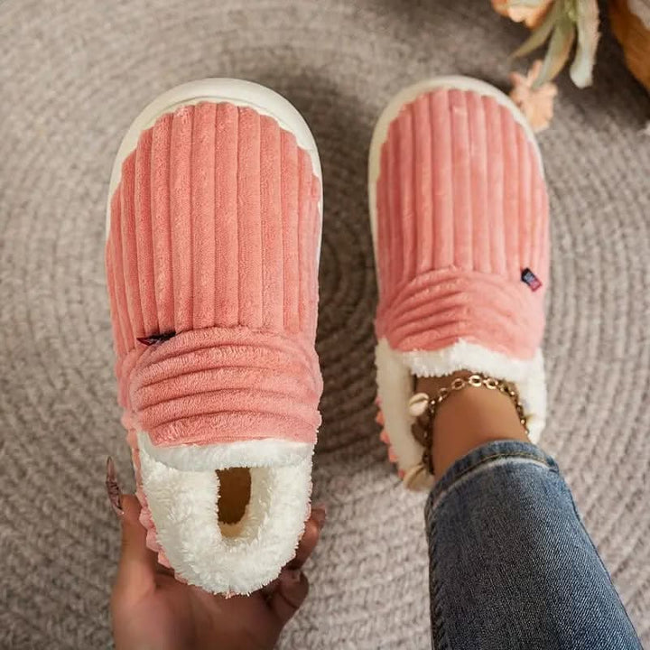 Slip into comfort with these warm, non-slip fleece house slippers.