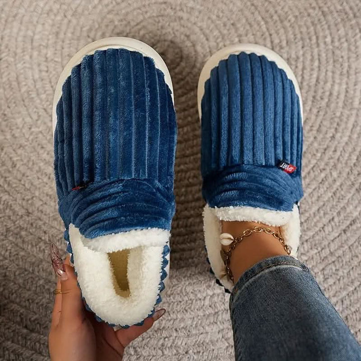 Durable non-slip sole on these unisex fleece-lined thermal slippers.