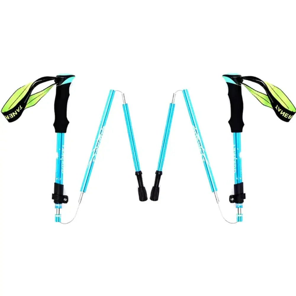Hiker using an adjustable foldable aluminum trekking pole on a mountain trail.