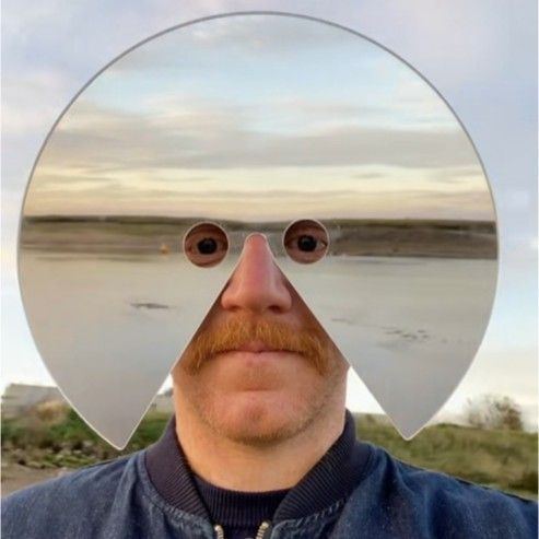 Shiny reflective mirror face mask, perfect novelty party accessory.