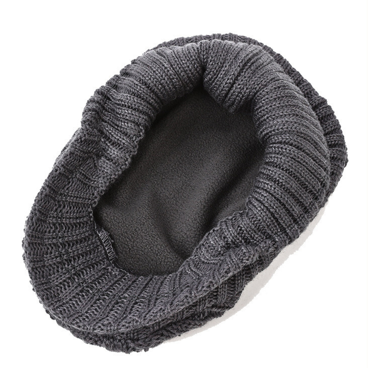Red cable knit flat cap, perfect for casual wear. This unisex winter hat has a classic textured design.