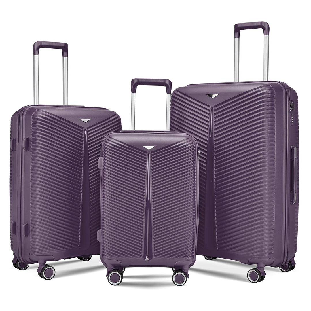 Traveler easily maneuvering a hardshell spinner luggage set through a bustling airport. Durable & agile.