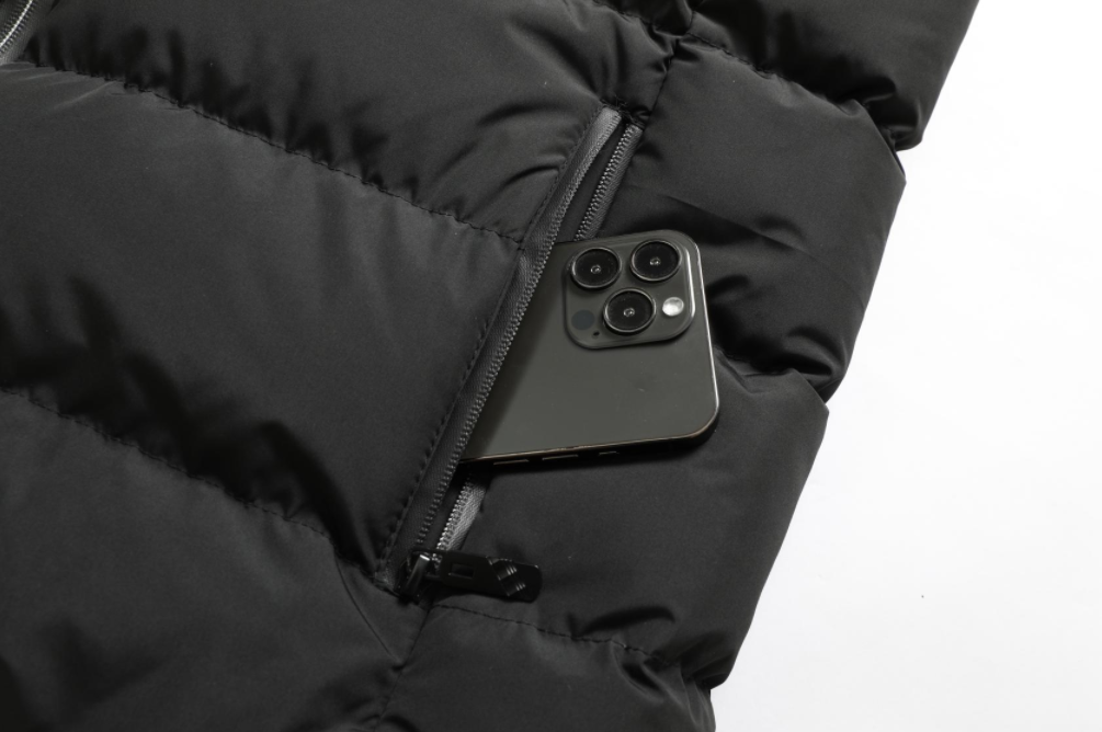 Essential outdoor gear: water-repellent unisex heated jacket, offering warmth and protection.