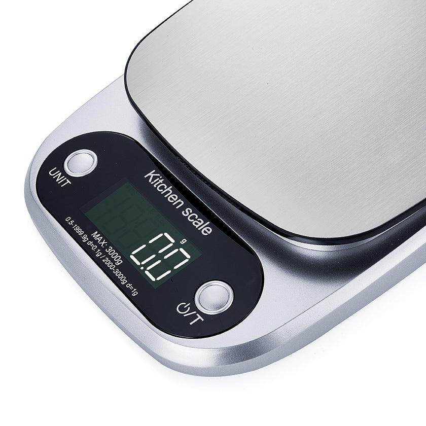 Compact digital food scale, essential for precise measurements in your home kitchen. Stainless steel top.