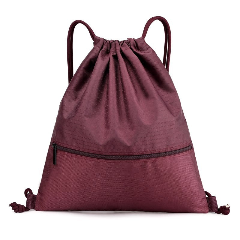 Travel-ready drawstring backpack, honeycomb material. Perfect for short trips, day excursions, and sports.
