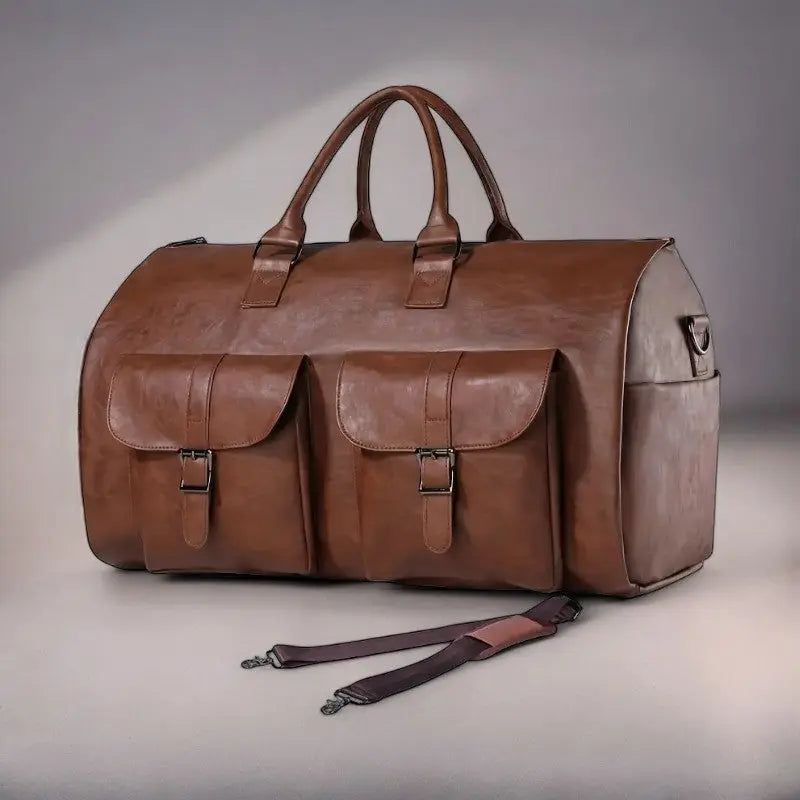 Unisex leather convertible duffle bag, ideal for carry-on travel & transforming into a garment bag.