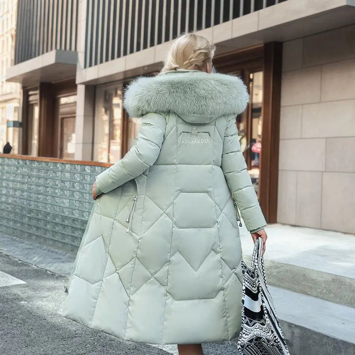 Close-up of the luxurious fluffy trim on the hood of a warm unisex long winter parka, emphasizing texture.