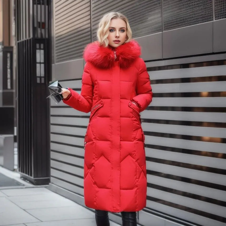 Model wearing the unisex long hooded winter parka in a snowy landscape, demonstrating its snow protection features.