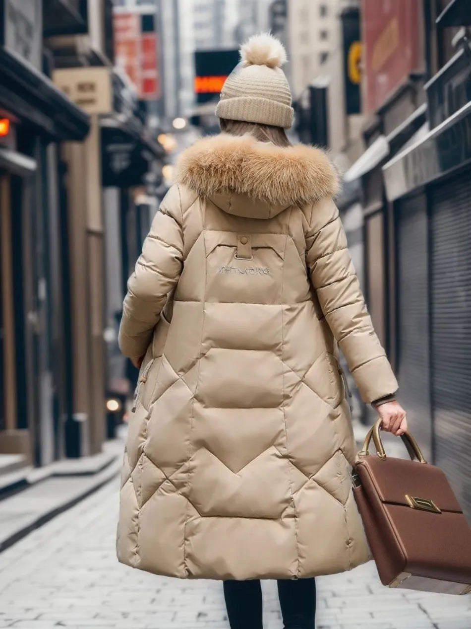 This long hooded winter parka provides ultimate cold weather defense, featuring an adjustable waist & fluffy trim.