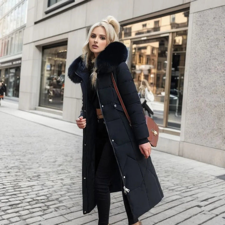 Outdoor shot of the unisex long winter parka, highlighting its robust design, insulated warmth, and fluffy hooded trim.