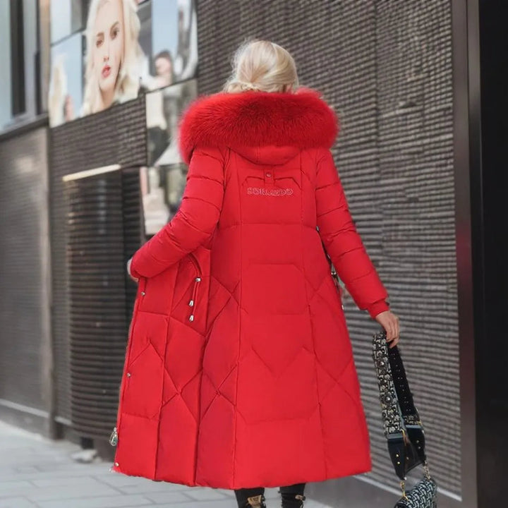 Insulated long winter parka for men & women, with practical utility pockets, adjustable waist, and fluffy hood trim.