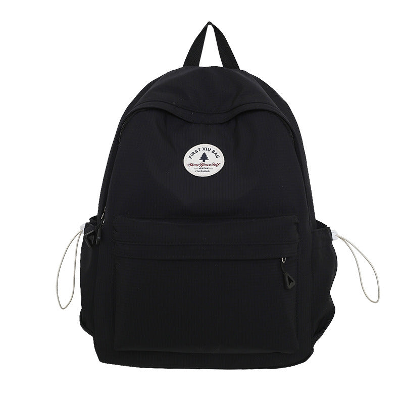 Durable water-resistant unisex school backpack, designed with strong fabric for everyday student and college use.
