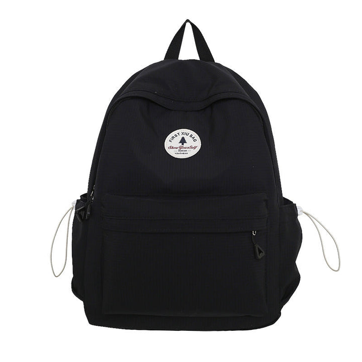 Durable water-resistant unisex school backpack, designed with strong fabric for everyday student and college use.