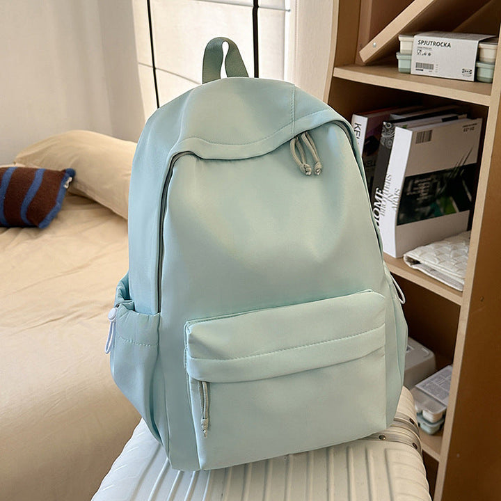 Functional unisex travel bag & daily commute backpack, offering ample storage and comfort.