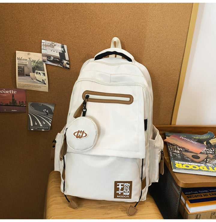 Functional unisex school backpack with multiple zippered pockets, ideal for organizing books, tech, & essentials for work/travel.