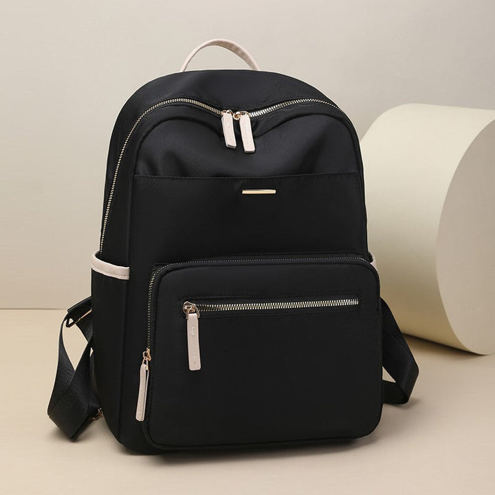 Unisex multi-pocket travel backpack, front view. Spacious and stylish for everyday carry or weekend trips.