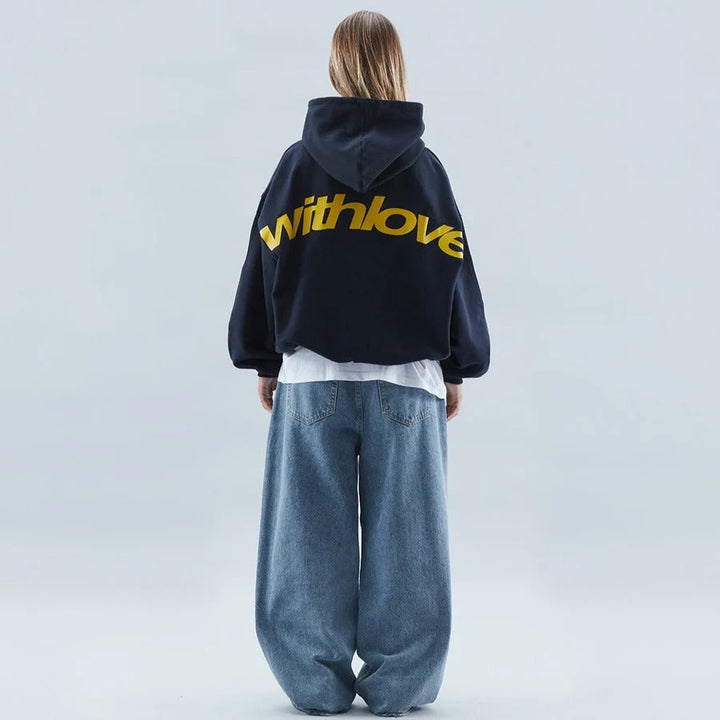 Streetwear essential: Unisex oversized hoodie with a stylish slogan print for winter.