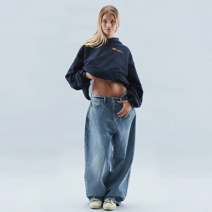 Oversized fit hoodie with a unique slogan, ideal for casual, everyday wear.