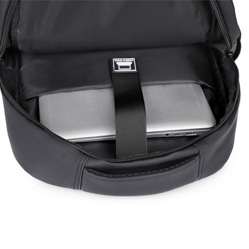 Water-resistant gray padded laptop backpack, unisex for daily commuting and travel.