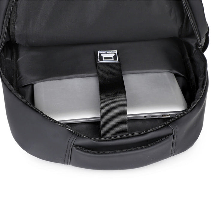 Water-resistant gray padded laptop backpack, unisex for daily commuting and travel.