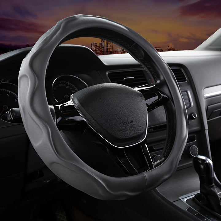 Enhance driving control with this non-slip PU leather steering wheel cover, a car accessory.