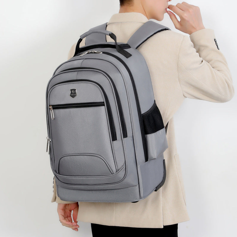 Versatile carry-on rolling backpack for trips & daily commutes. Features durable, water-resistant design.