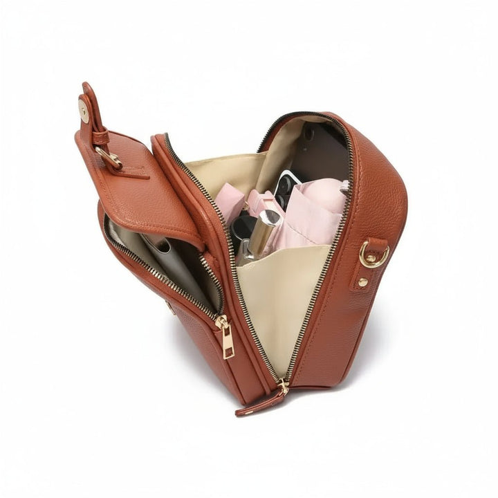 Compact anti-theft crossbody with hidden zippers, slash-resistant material & adjustable strap for security.