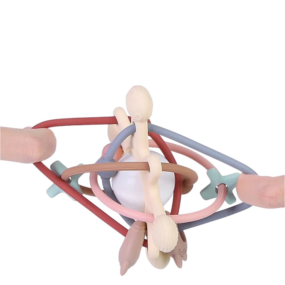 Multi-textured silicone baby teether with a fun play bell for sensory development.