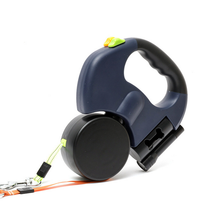 Pet owner using a dual dog leash with LED light for safe and easy night walking with two happy dogs.
