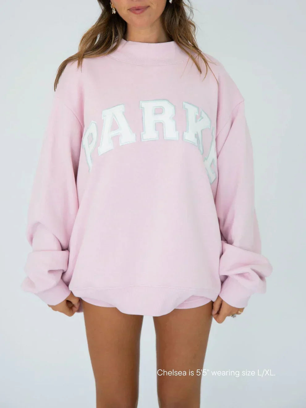 Unisex varsity hoodie with chenille lettering, oversized fit for casual streetwear.
