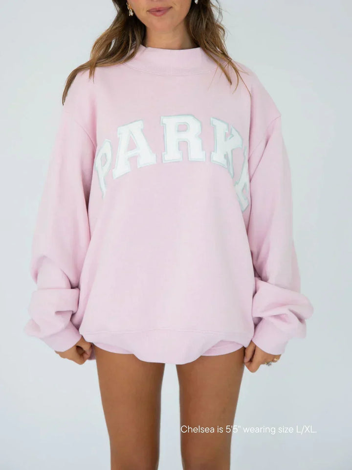 Unisex varsity hoodie with chenille lettering, oversized fit for casual streetwear.