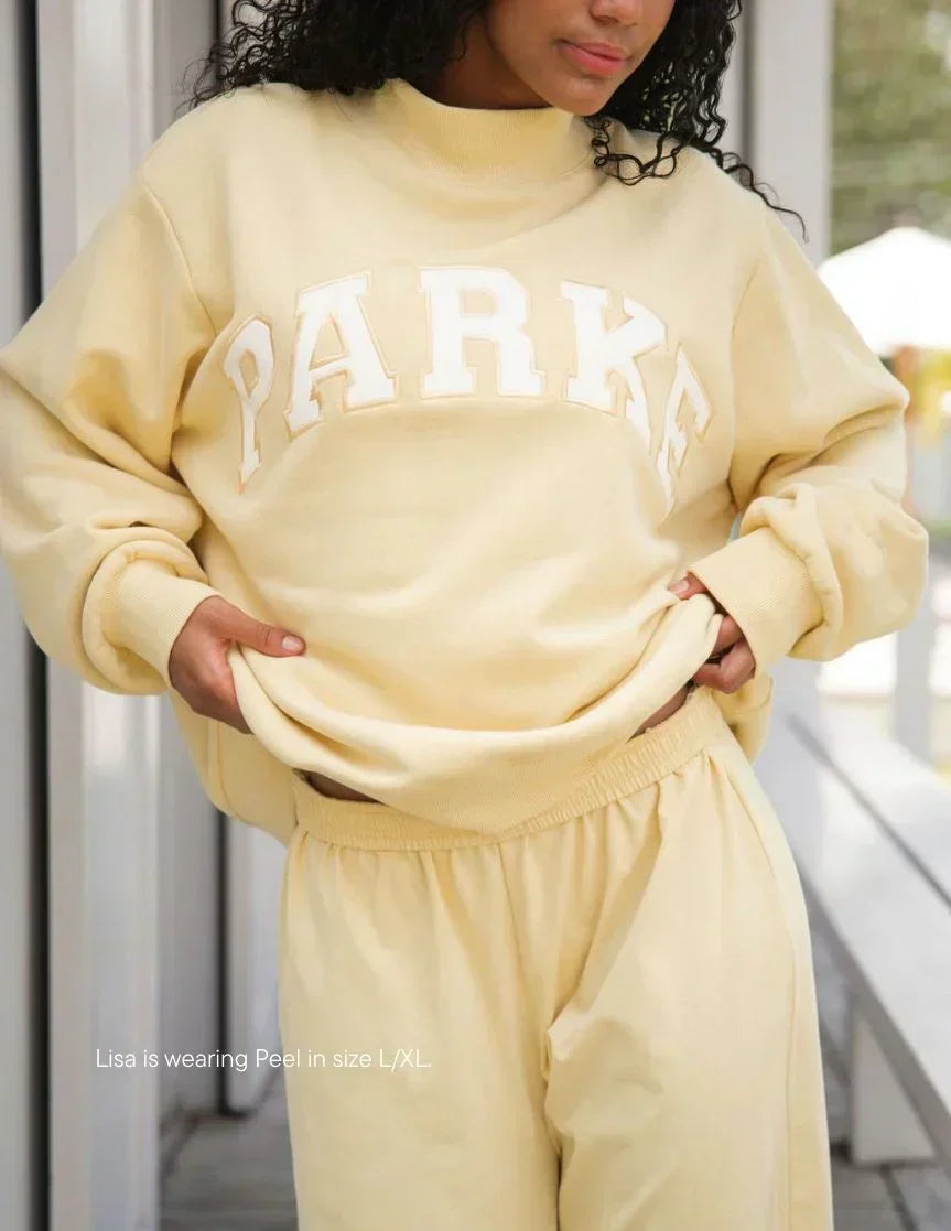 Relaxed fit chenille varsity hoodie, perfect for unisex collegiate streetwear.