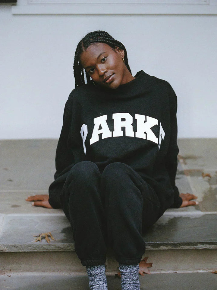 Collegiate spirit unisex hoodie, oversized with distinctive chenille letters.