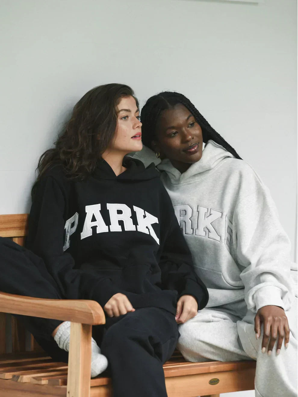 Super cozy unisex hoodie, chenille varsity letters for a relaxed, stylish look.