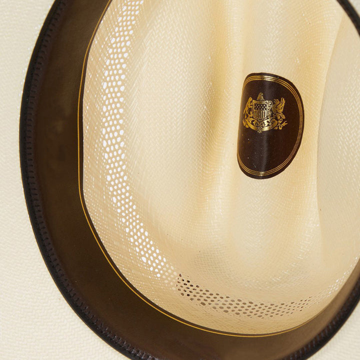 Durable ventilated cowboy hat for ranch wear & outdoor adventures, featuring a leather band & silver details.