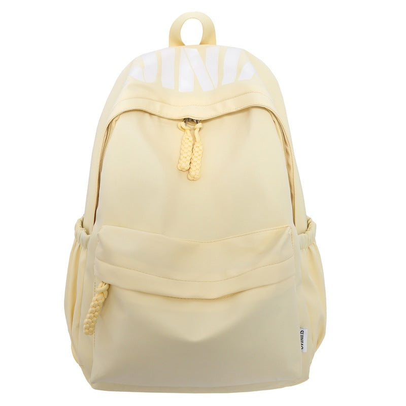 Side view of a blue water-resistant commuter backpack with secure pockets, great for school & active lifestyles.