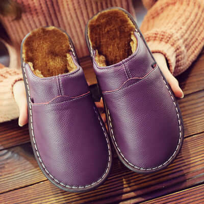 Stylish unisex waterproof house shoes, offering cushioned comfort for both indoor & outdoor casual wear. Slip-on design.