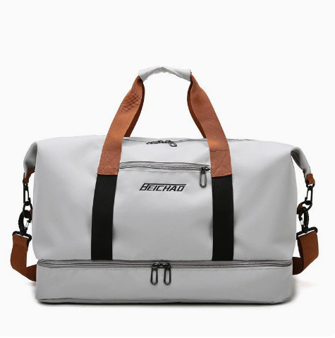 Compact carry-on duffel bag for air travel. Organized unisex weekender, perfect as personal item.