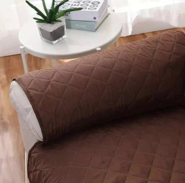 Soft fabric recliner cover with quilted design for ultimate comfort & furniture protection.
